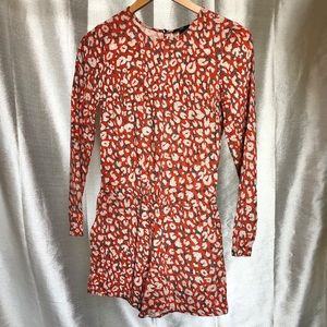Orange pattern long sleeve romper